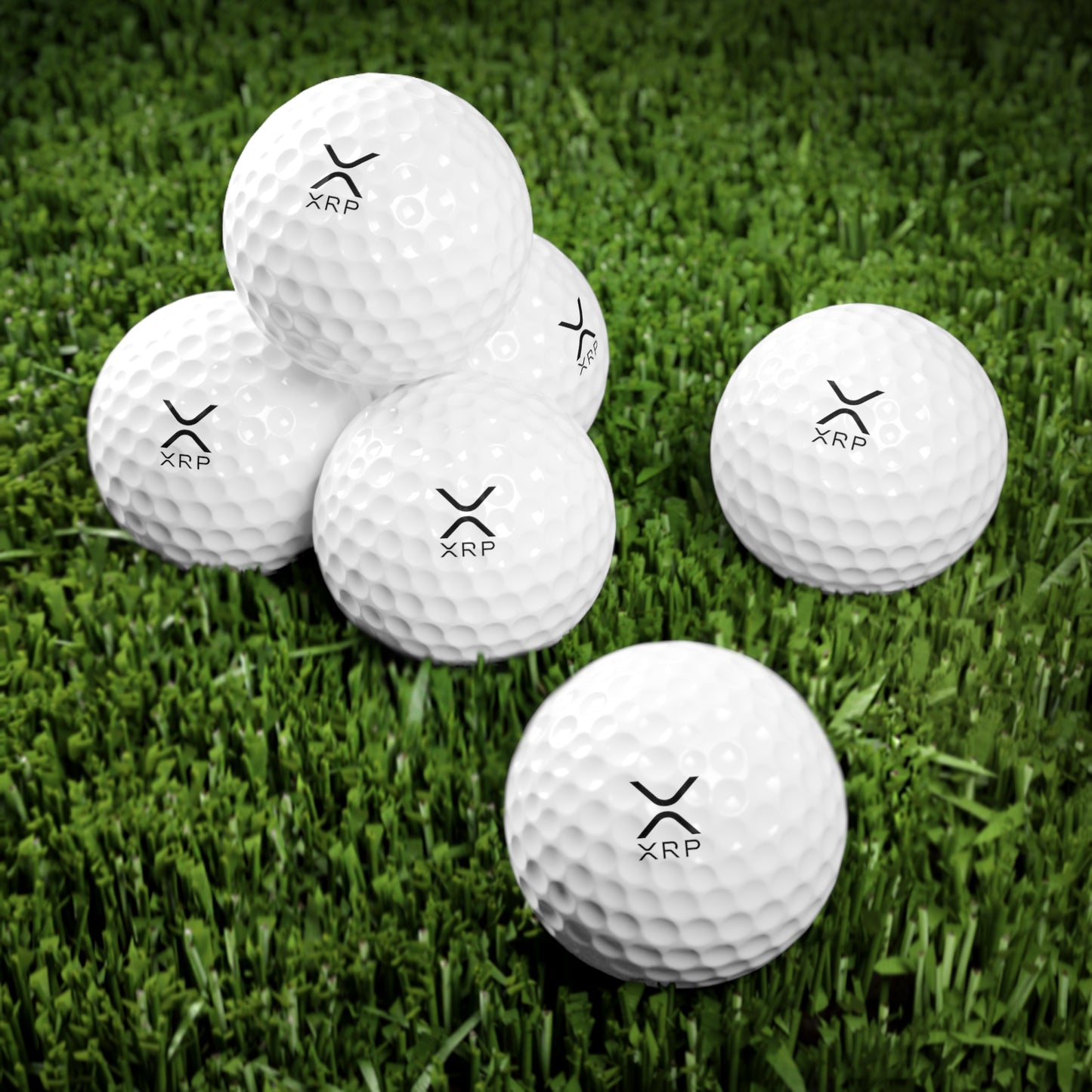 White golf ball featuring the bold XRP logo, designed by HODL Haus, blending premium sports performance with cryptocurrency-inspired style.