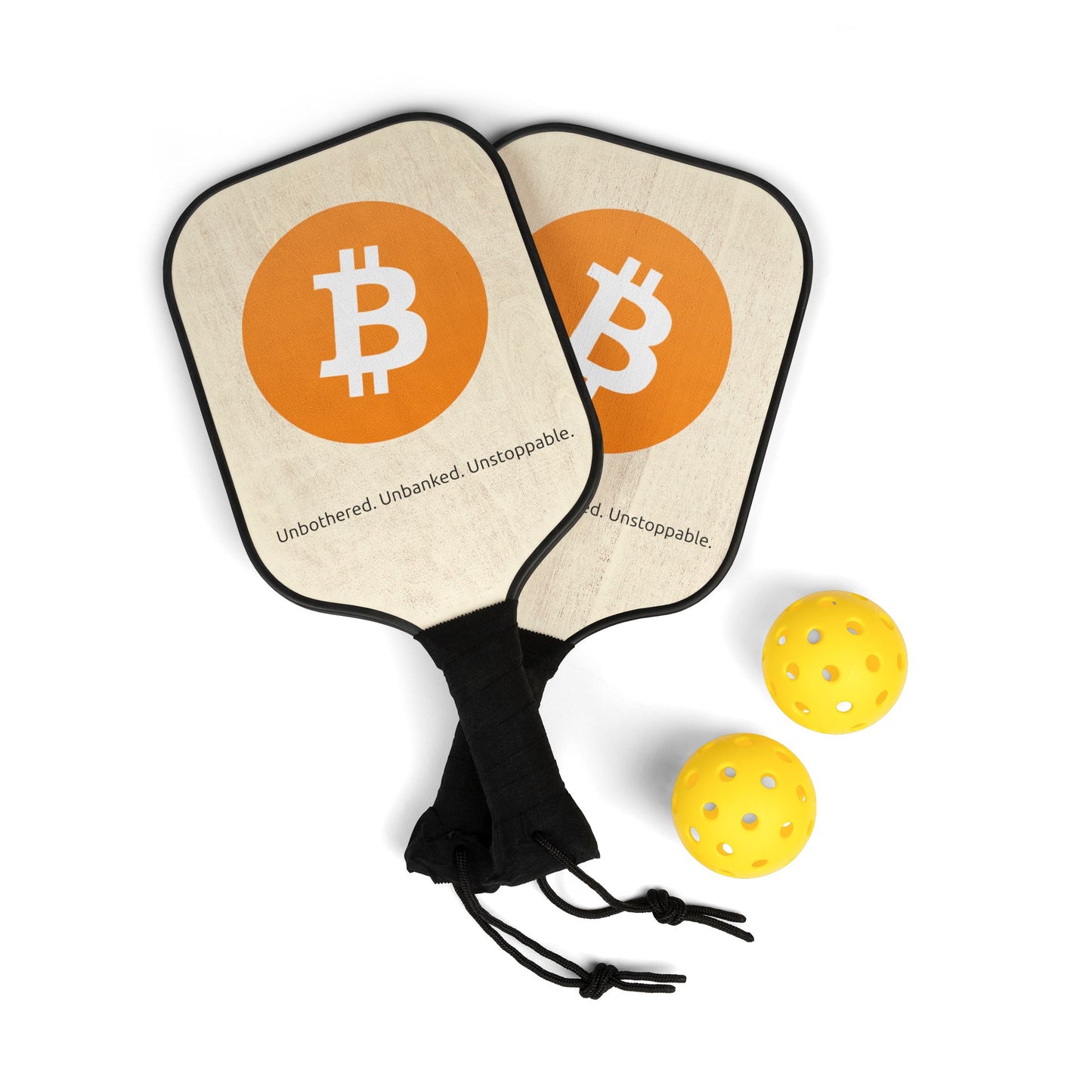 Bitcoin pickleball paddle set with ₿ symbol and “Unbothered. Unbanked. Unstoppable.” slogan, includes carry bag and balls.